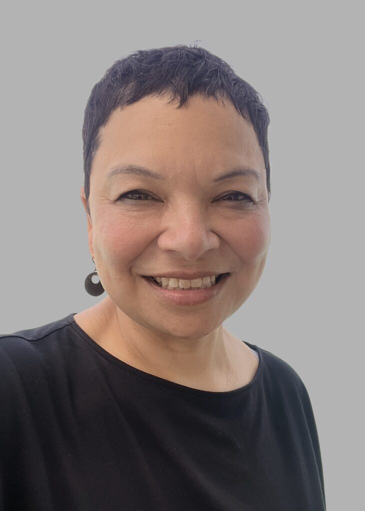 Image of woman in black top with short black hair